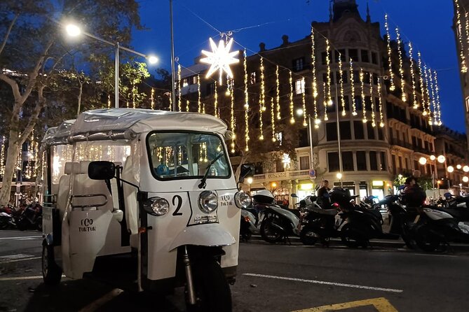 Christmas Lights Tour of Barcelona in Private Eco Tuk Tuk - Robert Palace and the upper end of Passeig de Gracia