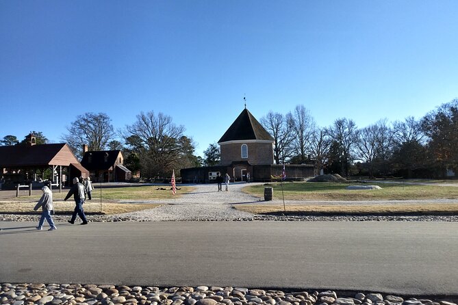 Guided Colonial Christmas Tour in Williamsburg - A costumed guide and the Christmas candle