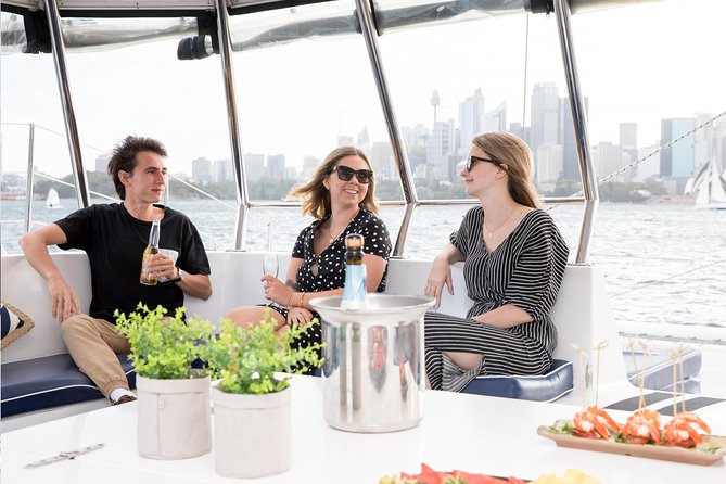 Sydney Harbour BYO New Year's Eve Catamaran Cruise - The Opera House and the harbour shoreline